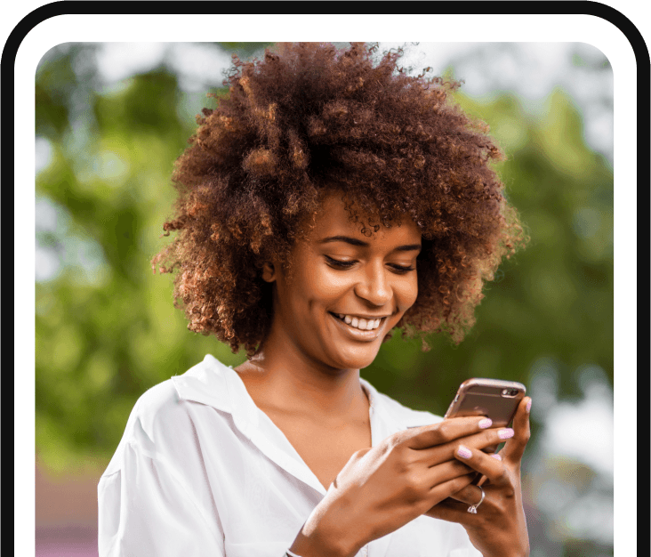 Lady smiling looking into smartphone - MyNebor 